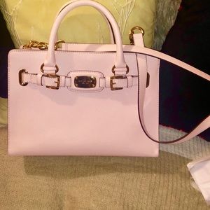 Light pink Michael Kors bag with gold hardware.